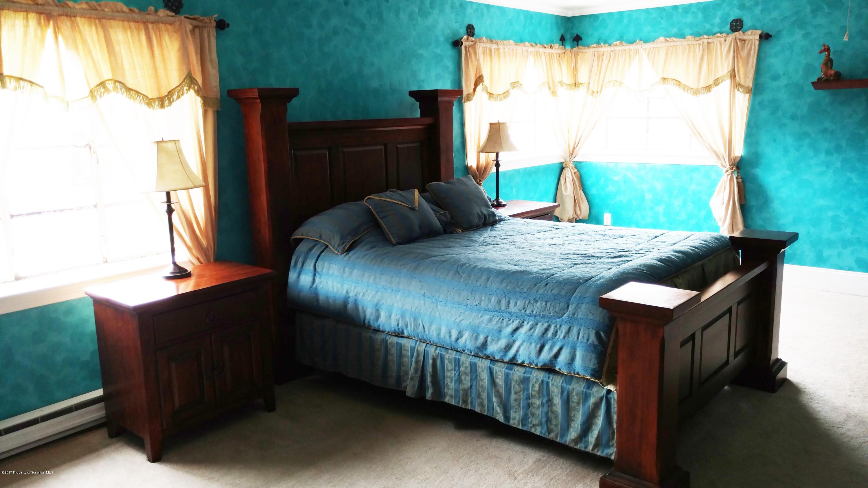 110 Hillcrest Road Moscow, PA 18444 - Photo 15 of 19 a bedroom with a bed dresser and a window