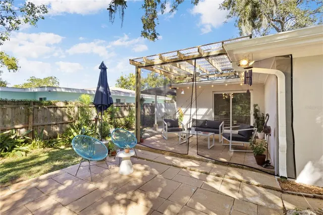 a view of a chairs and table in a patio