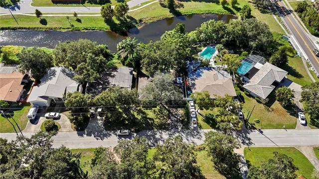 an aerial view of a house with a yard and garden