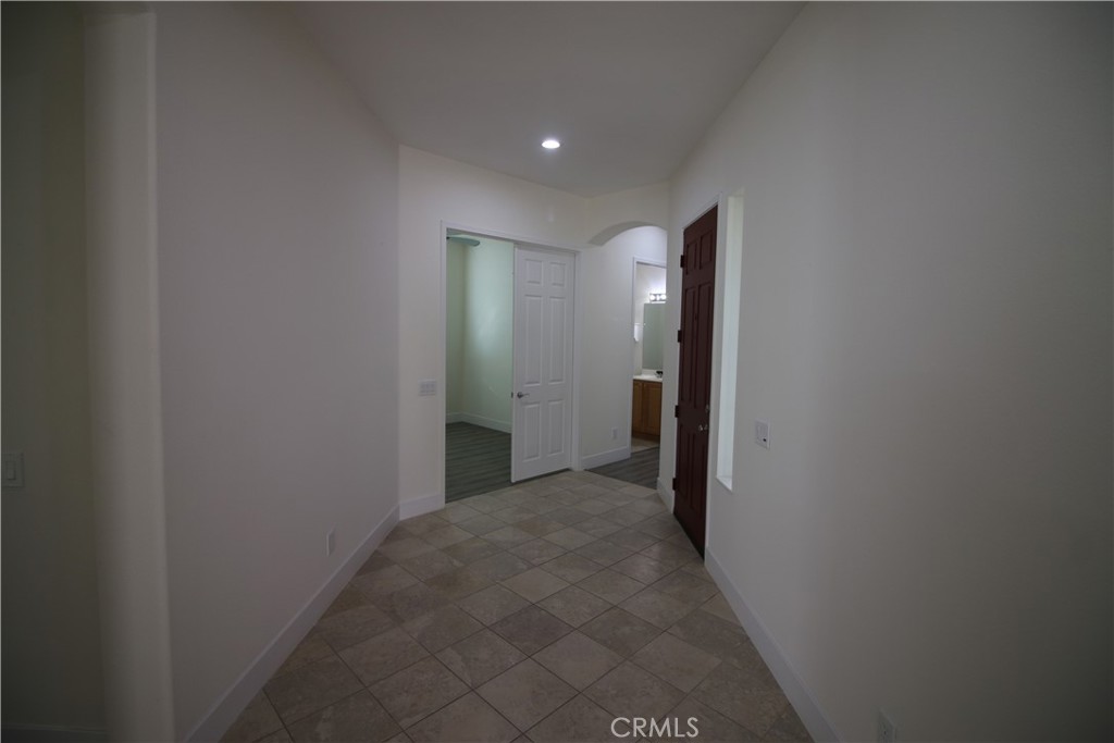 805 Annandale Road Beaumont, CA 92223 - Photo 21 of 39 a view of hallway with closet and a bathroom
