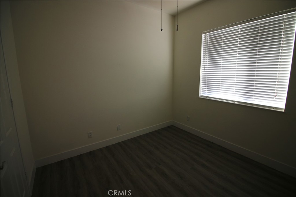 805 Annandale Road Beaumont, CA 92223 - Photo 22 of 39 a view of a small space with wooden floor and a window