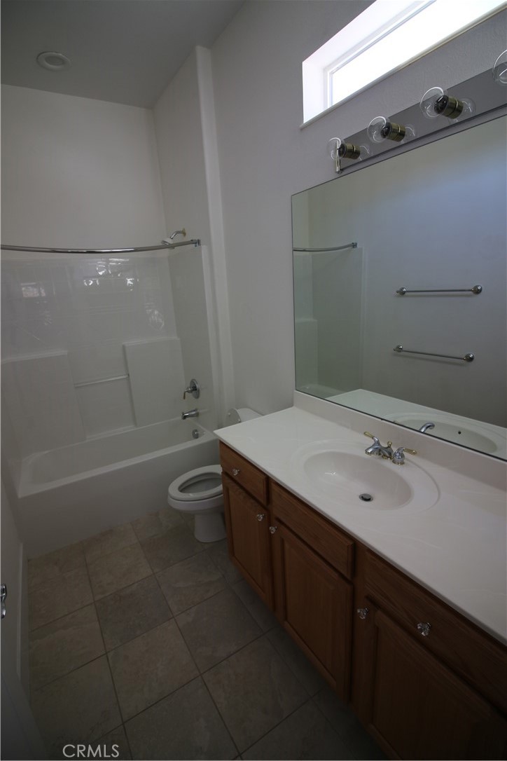 805 Annandale Road Beaumont, CA 92223 - Photo 30 of 39 a bathroom with a sink a toilet and shower