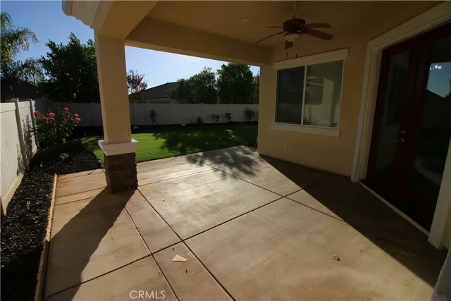a view of a porch with furniture and yard