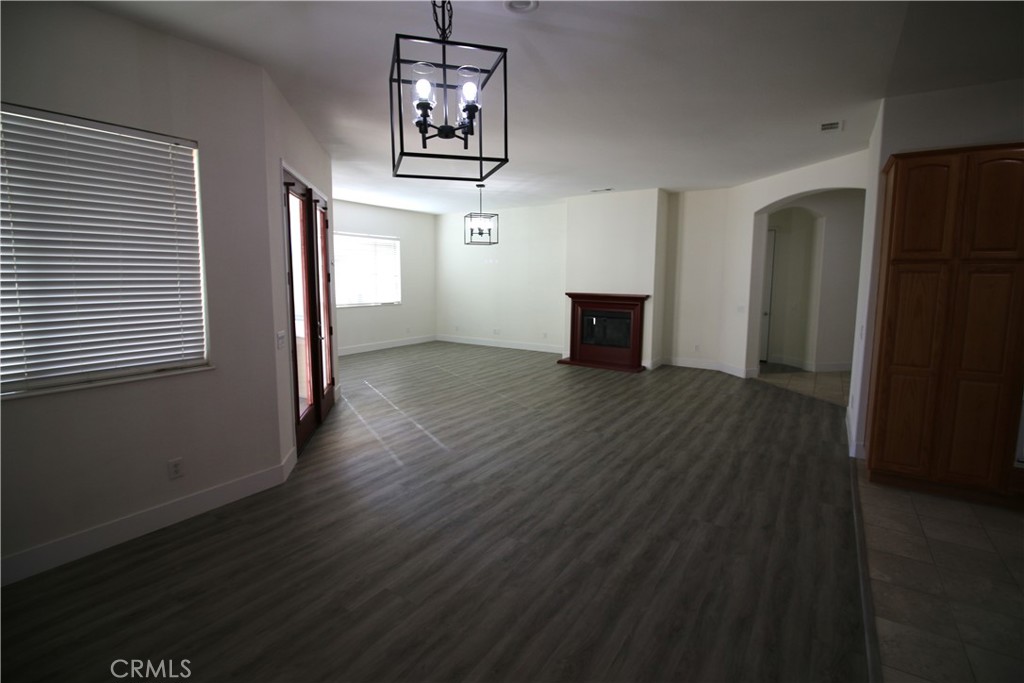 805 Annandale Road Beaumont, CA 92223 - Photo 9 of 39 an empty room with wooden floor closet and windows