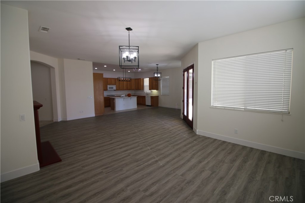 805 Annandale Road Beaumont, CA 92223 - Photo 10 of 39 a view of a livingroom with wooden floor and stairs