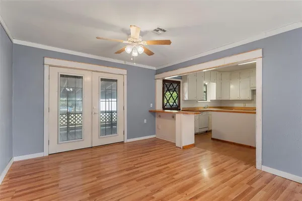 a view of a kitchen cabinets and wooden floor