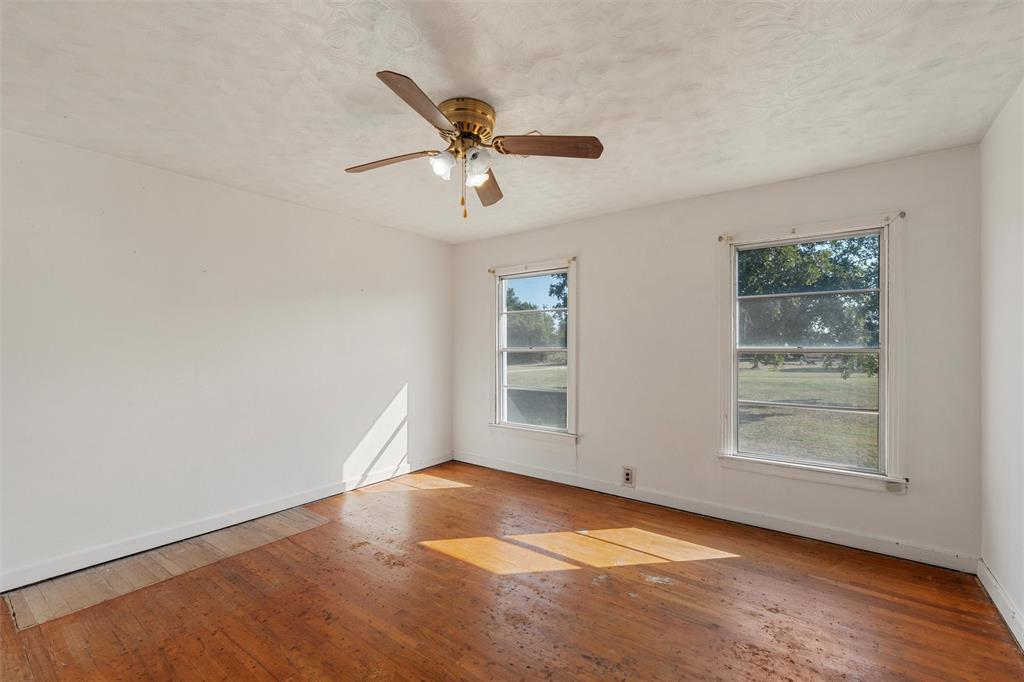 12145 Tree Lake Drive Waco, TX 76708 - Photo 14 of 40 an empty room with windows and fan