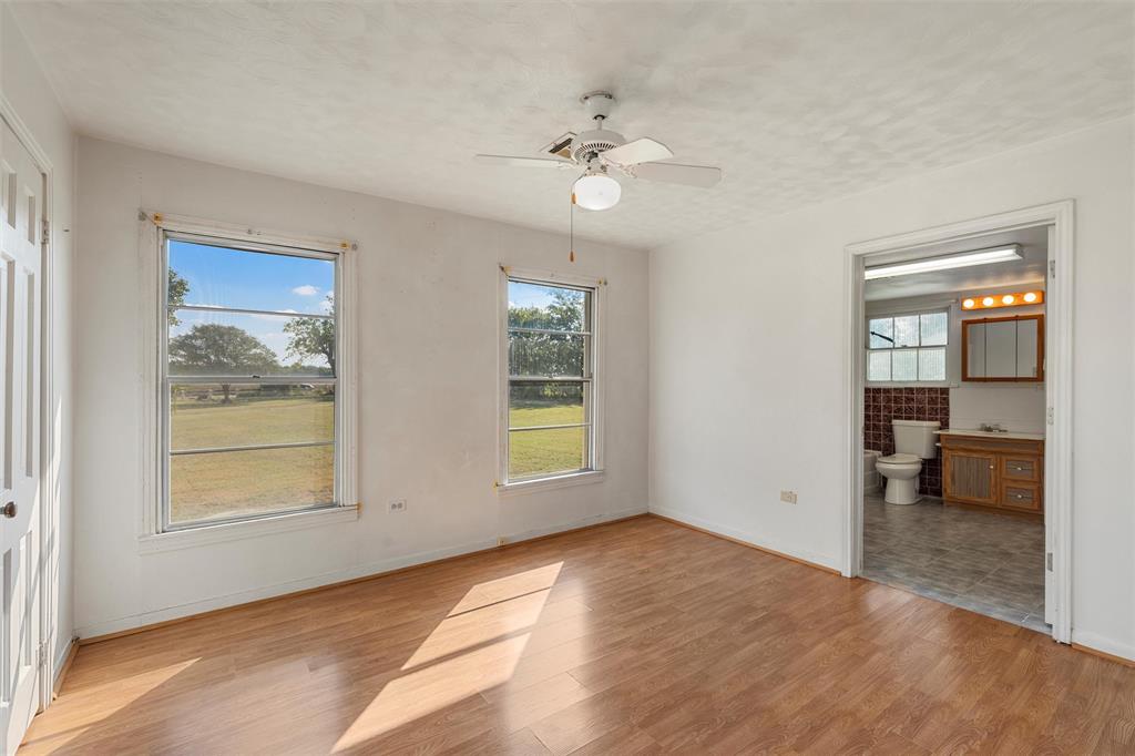 12145 Tree Lake Drive Waco, TX 76708 - Photo 20 of 40 an empty room with fan and windows