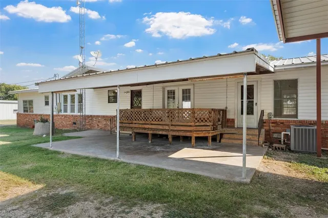 a house view with a sitting space and garden space