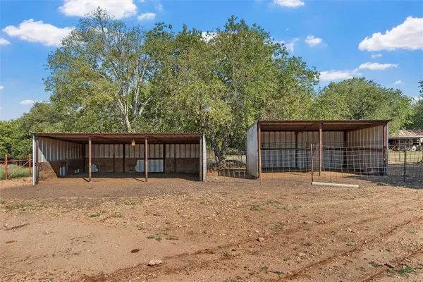 a house with trees in the background