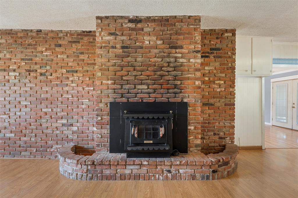 12145 Tree Lake Drive Waco, TX 76708 - Photo 6 of 40 a brick building with a fireplace