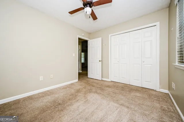 an empty room with wooden door