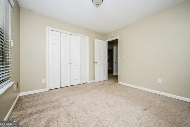 a view of an empty room with windows