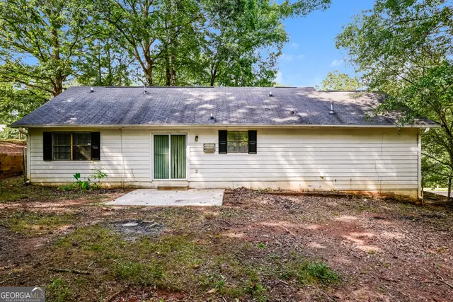 a house view with a backyard space