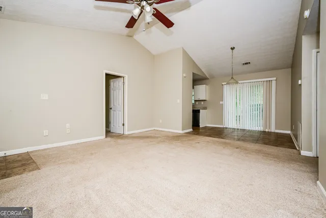 a view of empty room with windows