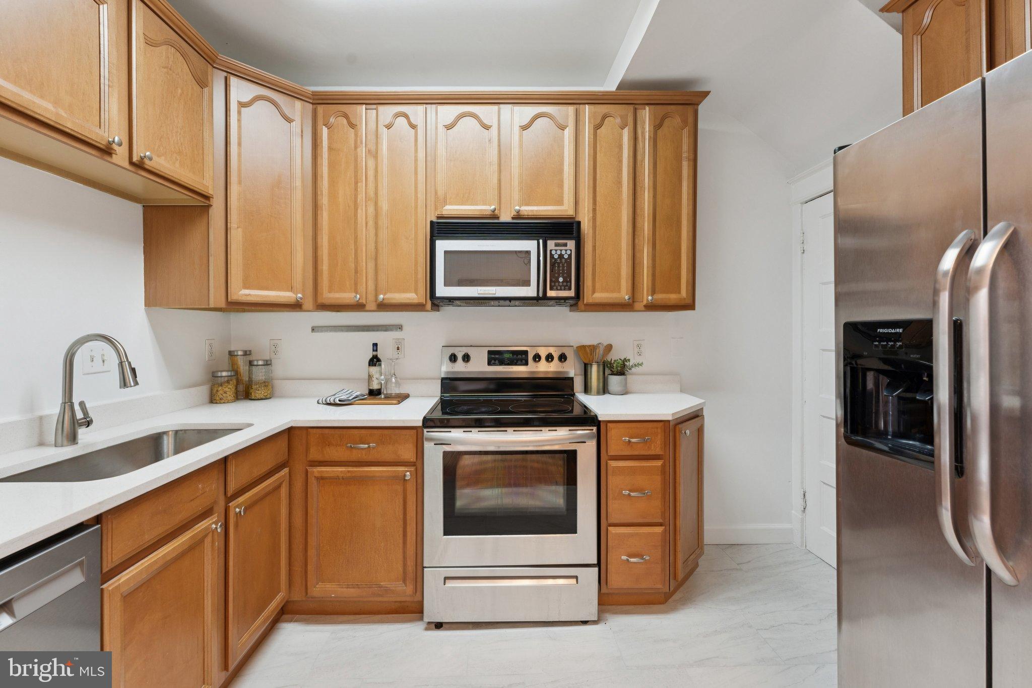 2215 2nd Street Northwest Washington, DC 20001 - Photo 12 of 34 a kitchen with a stove microwave and sink