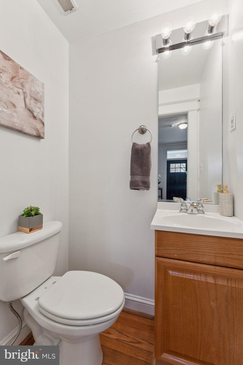 2215 2nd Street Northwest Washington, DC 20001 - Photo 15 of 34 a bathroom with a toilet sink and mirror