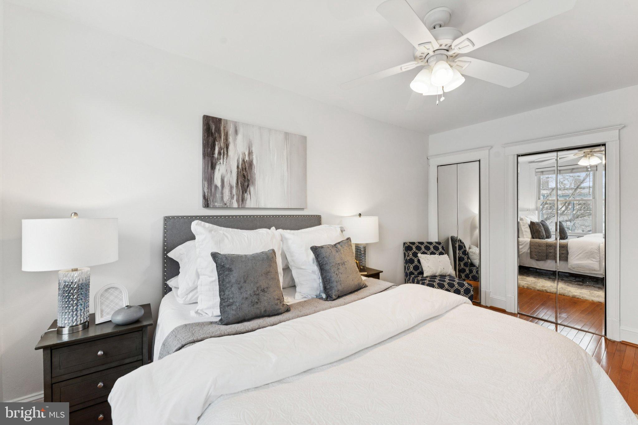 2215 2nd Street Northwest Washington, DC 20001 - Photo 18 of 34 a bedroom with a bed and a lamp