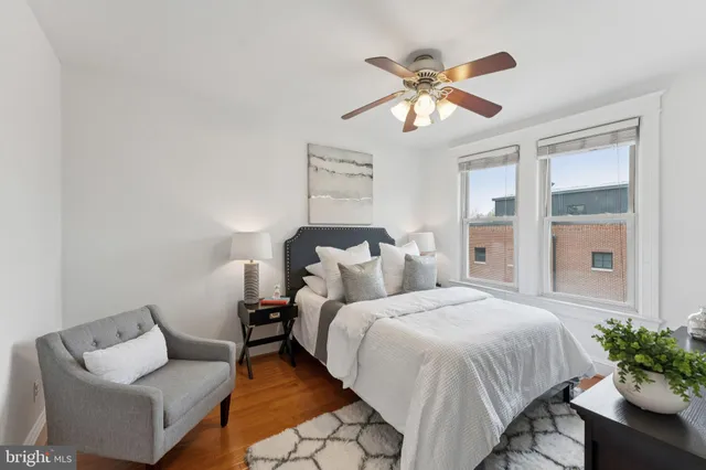 a bedroom with a bed and a lamp