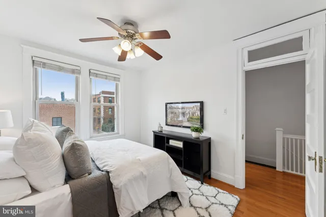 a bedroom with bed and window