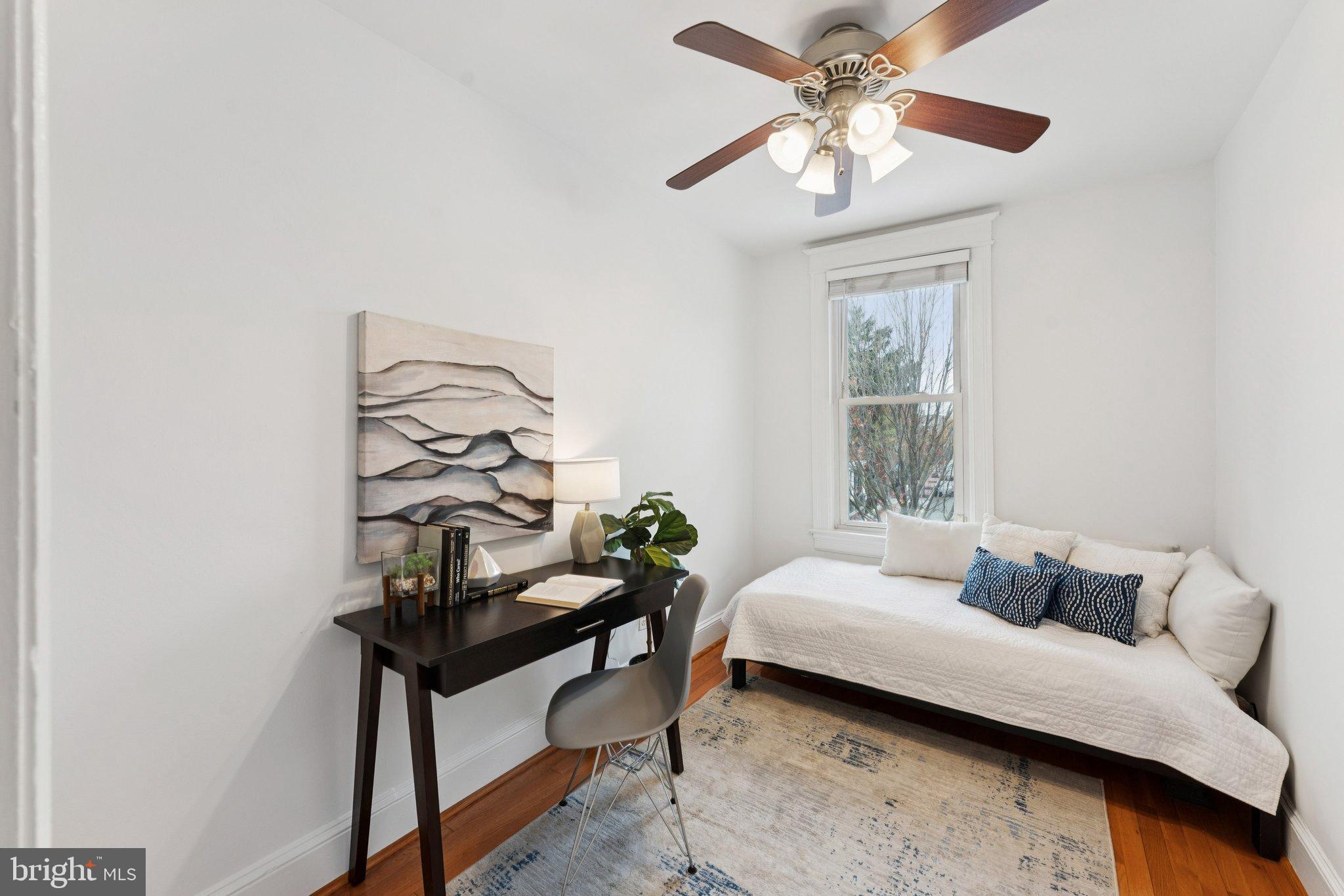 2215 2nd Street Northwest Washington, DC 20001 - Photo 23 of 34 a bedroom with furniture and a window