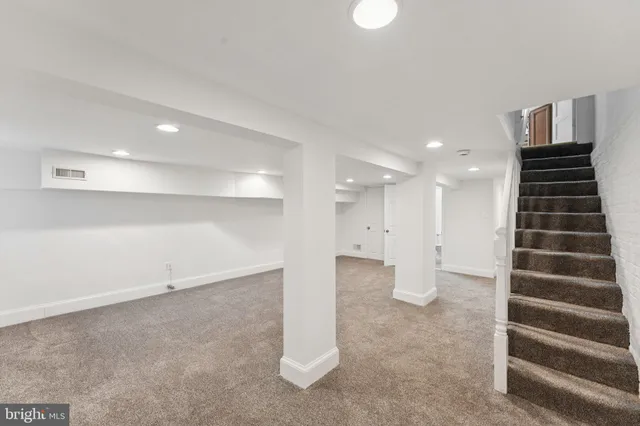 a white bath tub sitting next to a white toilet