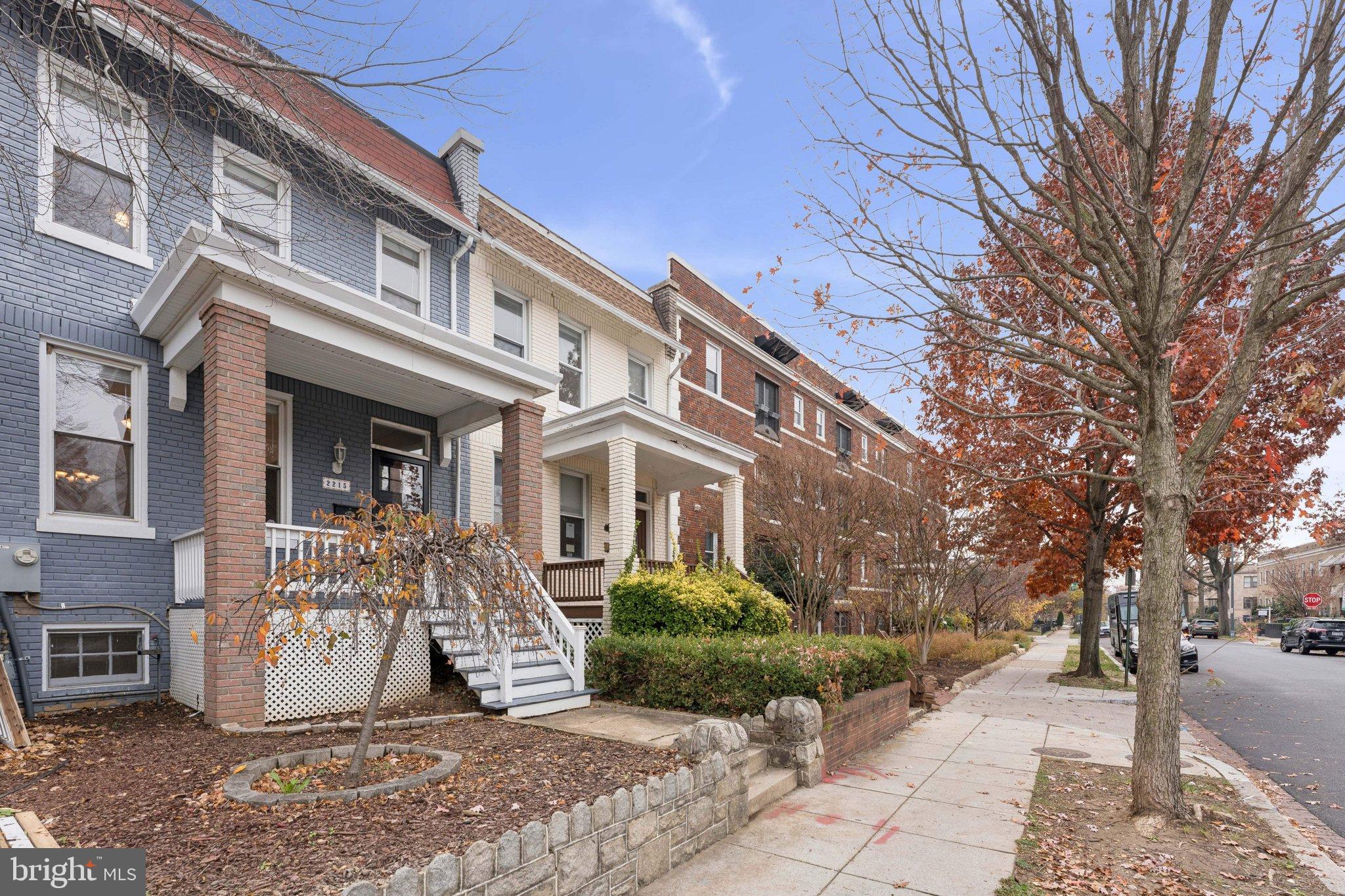 2215 2nd Street Northwest Washington, DC 20001 - Photo 32 of 34 a view of a brick house with large windows and a tree