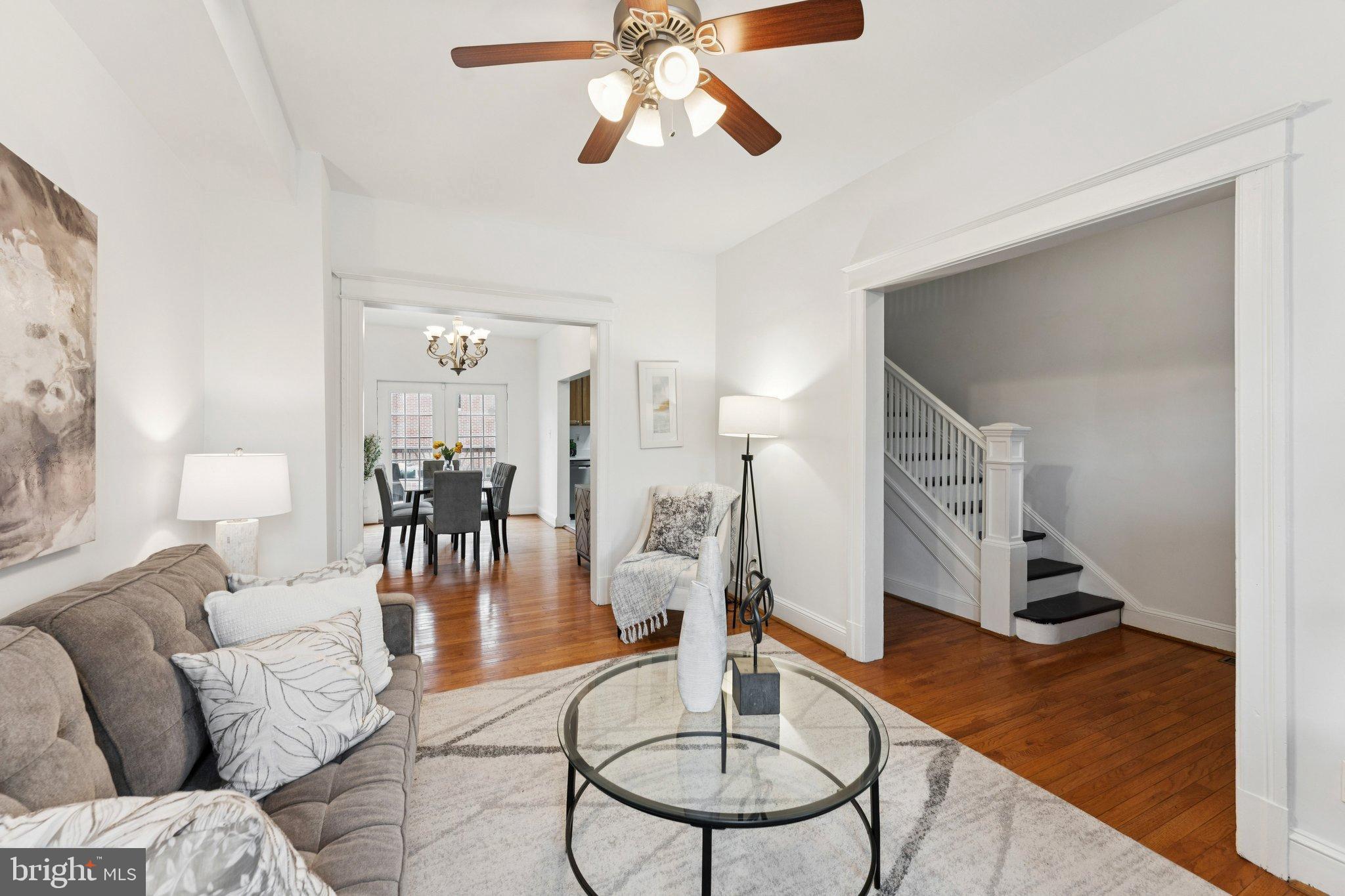 2215 2nd Street Northwest Washington, DC 20001 - Photo 4 of 34 a living room with furniture and a chandelier
