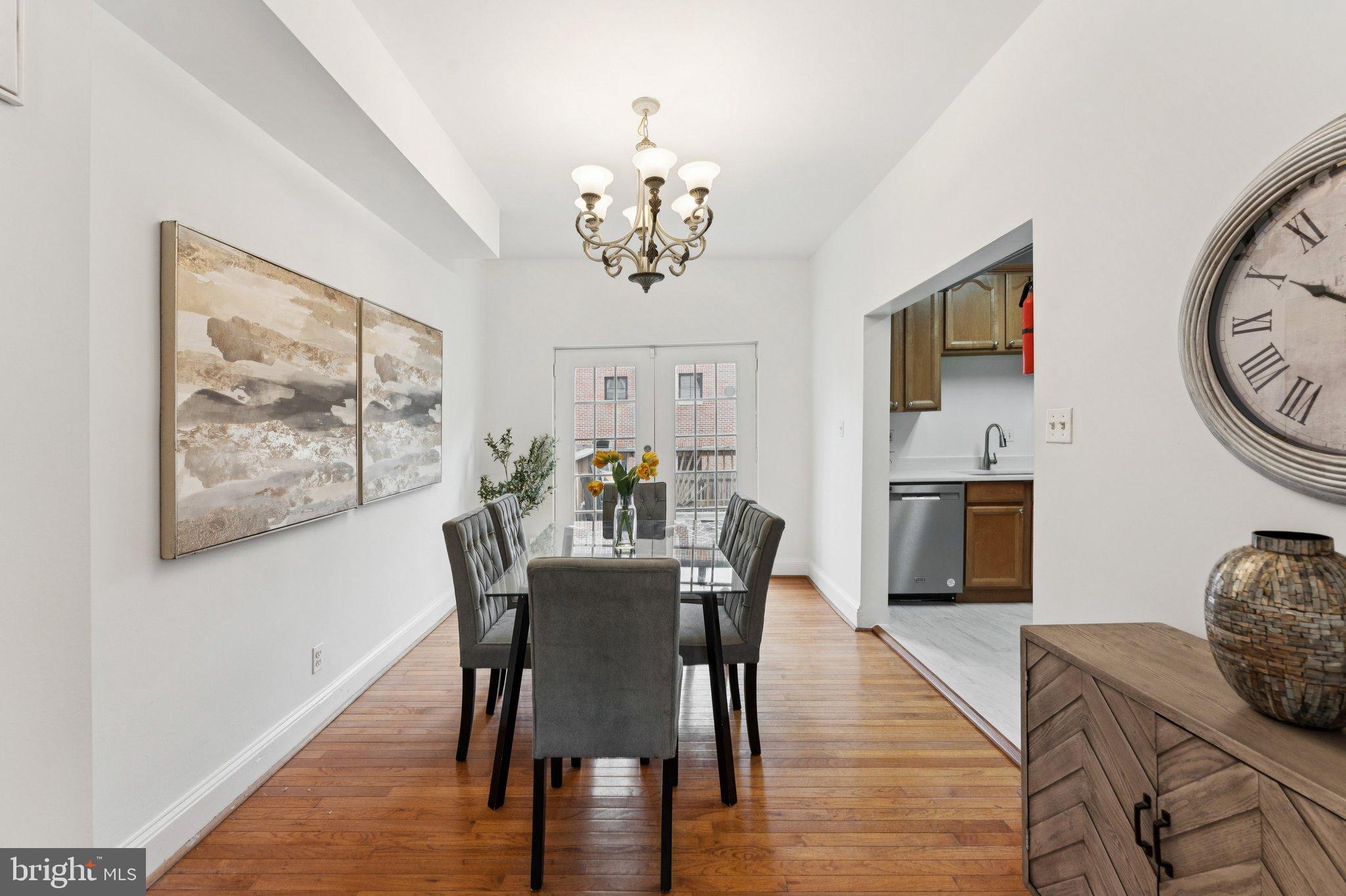 2215 2nd Street Northwest Washington, DC 20001 - Photo 7 of 34 a view of a dining room with furniture wooden floor and a chandelier