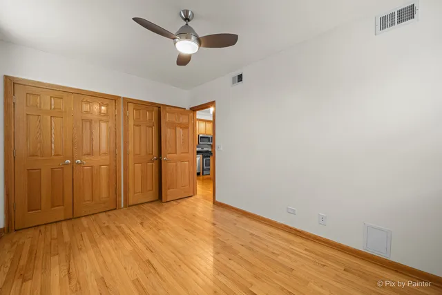 a view of front door with wooden floor