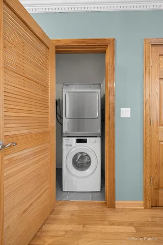 a view of a kitchen with furniture and wooden floor