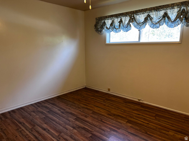 338 South 300 West Helper, UT 84526 - Photo 11 of 20 Unfurnished room with dark wood-style floors