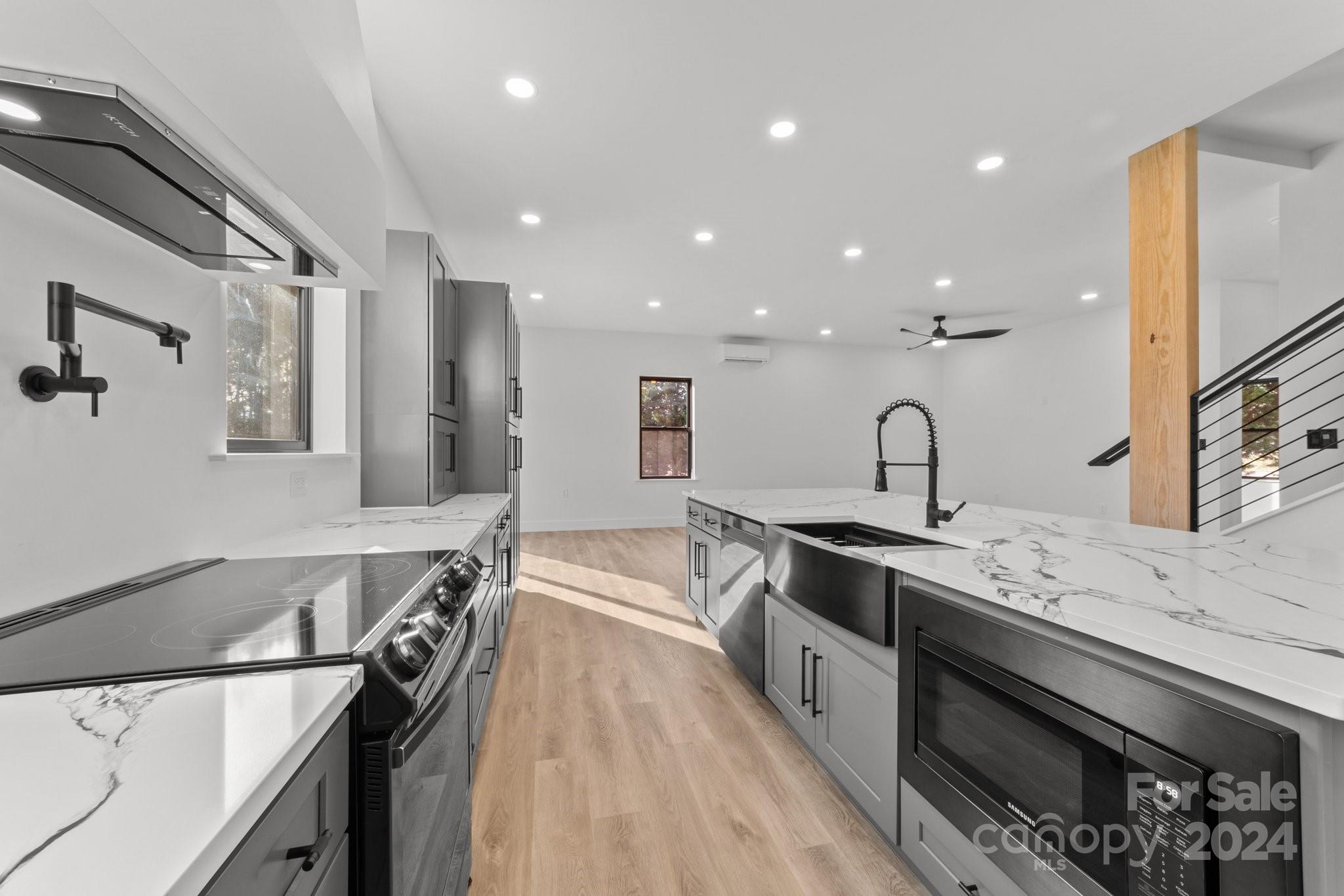 9288 Sherrills Ford Road Terrell, NC 28682 - Photo 11 of 47 a kitchen with stainless steel appliances granite countertop a sink stove and refrigerator