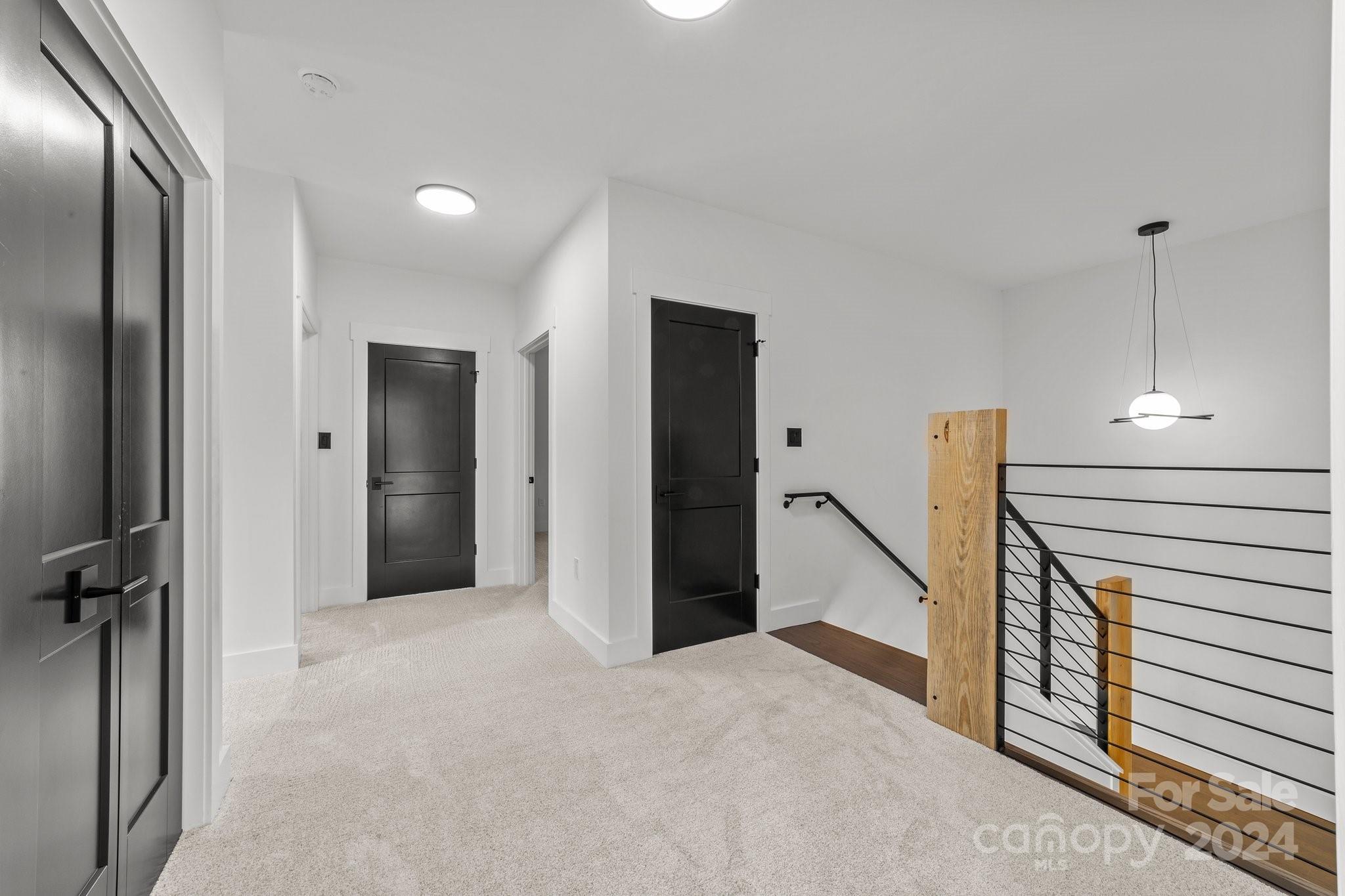 9288 Sherrills Ford Road Terrell, NC 28682 - Photo 17 of 47 a view of a hallway with closet and a ceiling fan