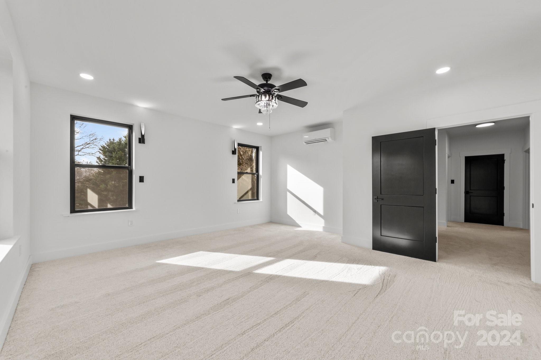 9288 Sherrills Ford Road Terrell, NC 28682 - Photo 18 of 47 a view of a livingroom with a chandelier fan and windows
