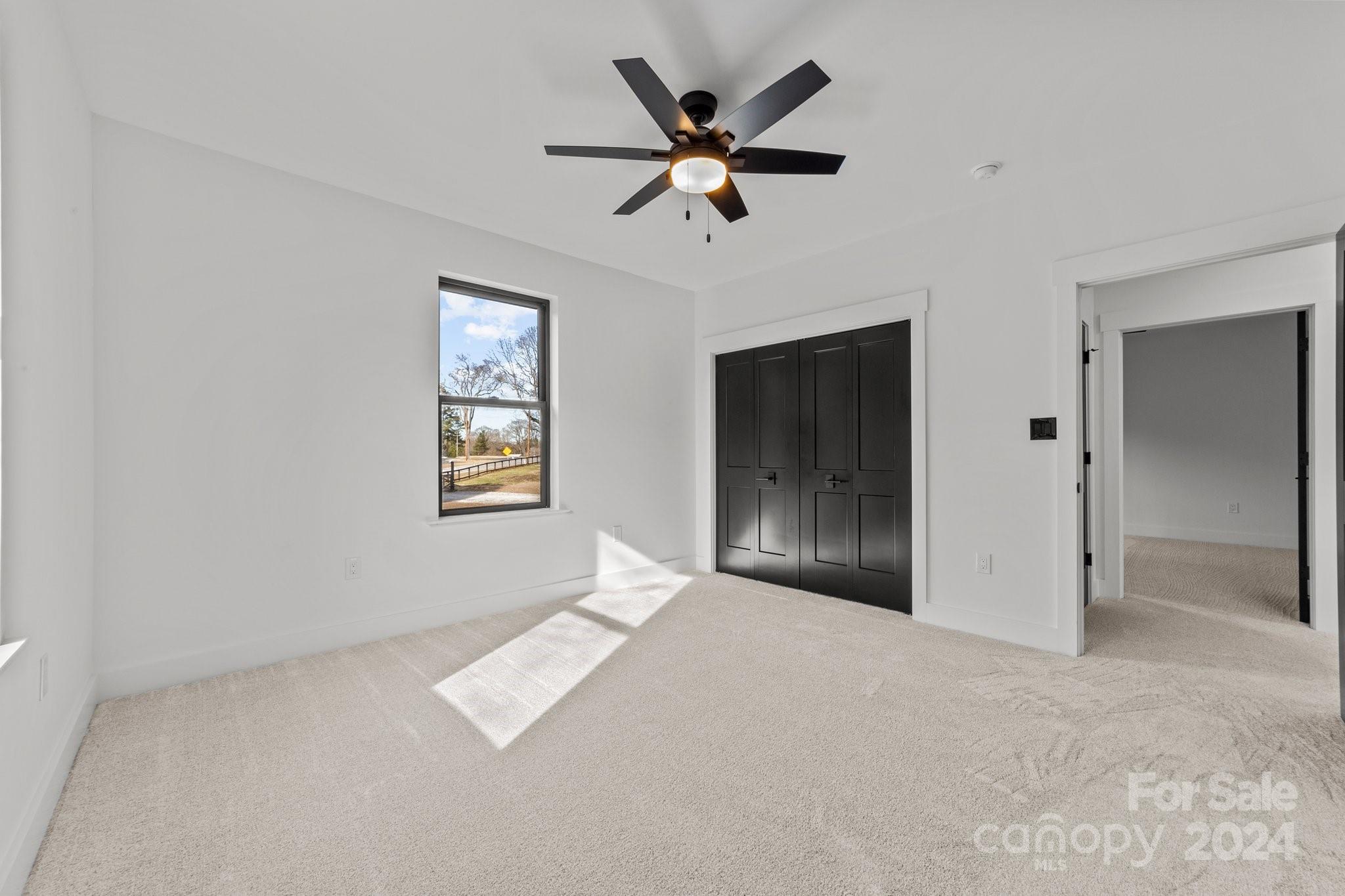 9288 Sherrills Ford Road Terrell, NC 28682 - Photo 19 of 47 a view of an empty room with a ceiling fan
