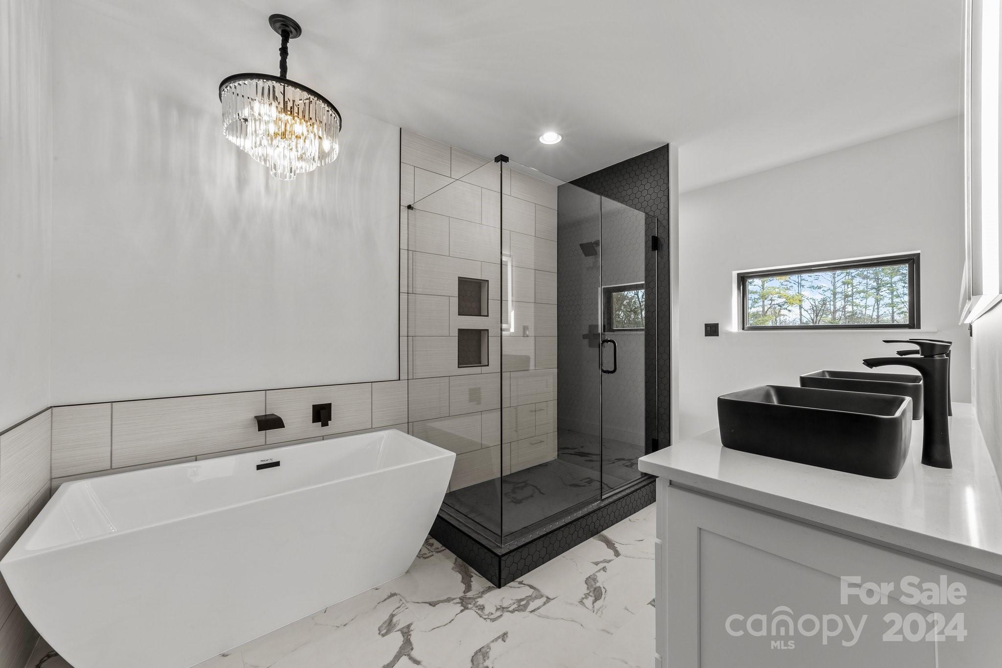 9288 Sherrills Ford Road Terrell, NC 28682 - Photo 22 of 47 a spacious bathroom with a bathtub and a shower