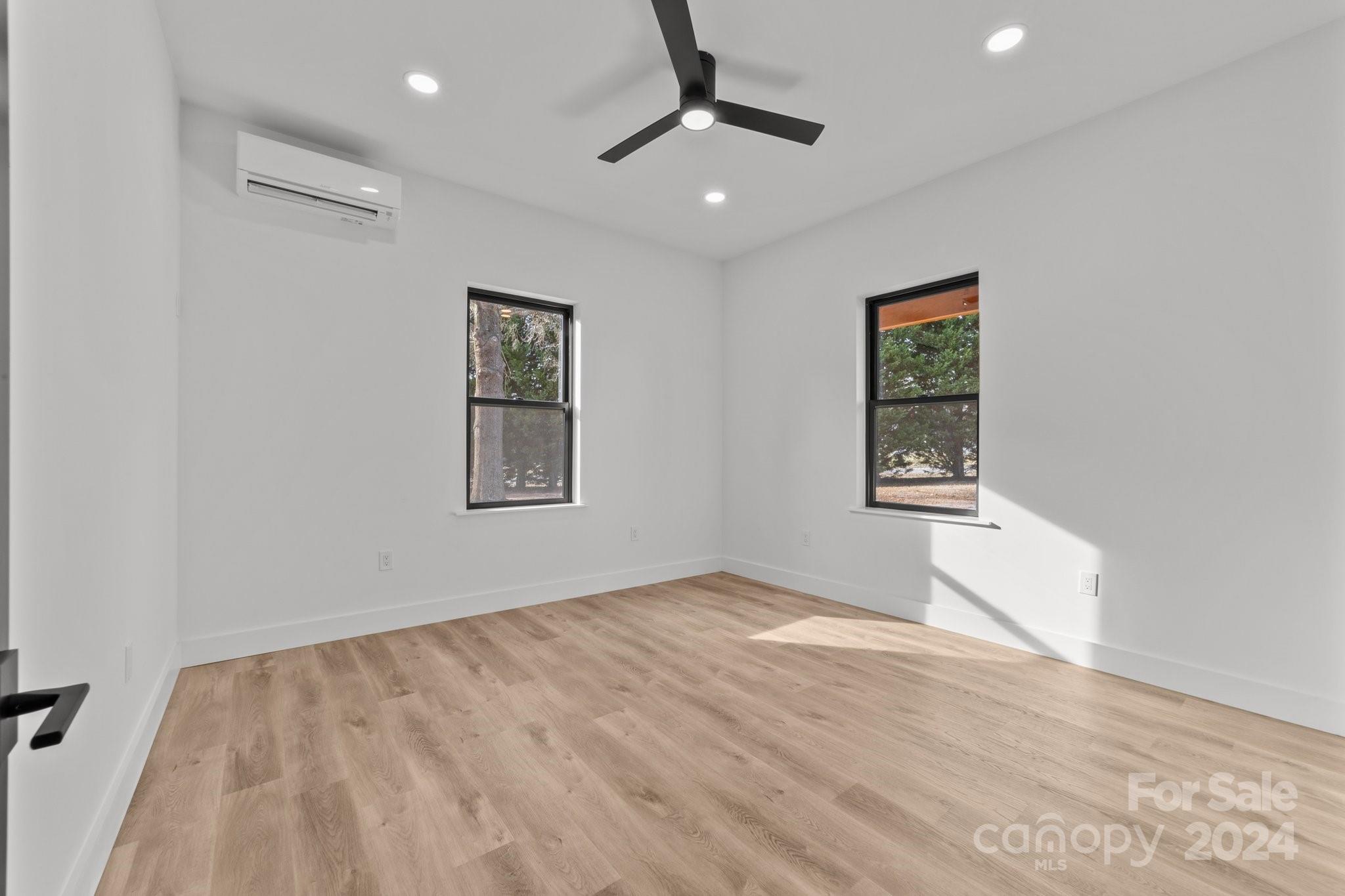 9288 Sherrills Ford Road Terrell, NC 28682 - Photo 26 of 47 an empty room with windows and fan