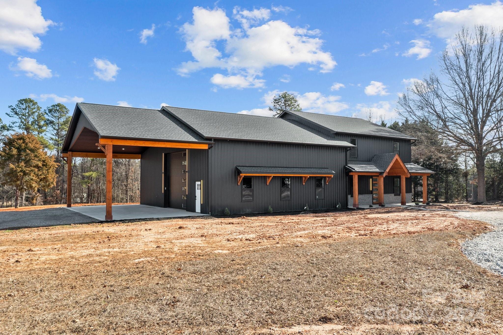 9288 Sherrills Ford Road Terrell, NC 28682 - Photo 39 of 47 a front view of a house with a yard covered in snow