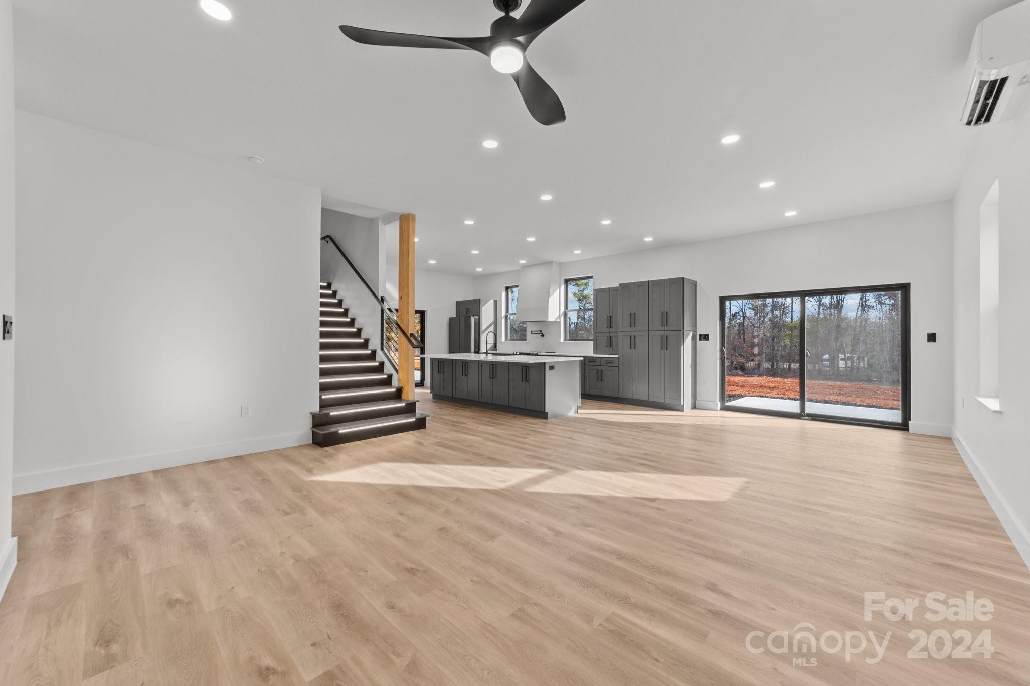 9288 Sherrills Ford Road Terrell, NC 28682 - Photo 6 of 47 a view of empty room with wooden floor and windows