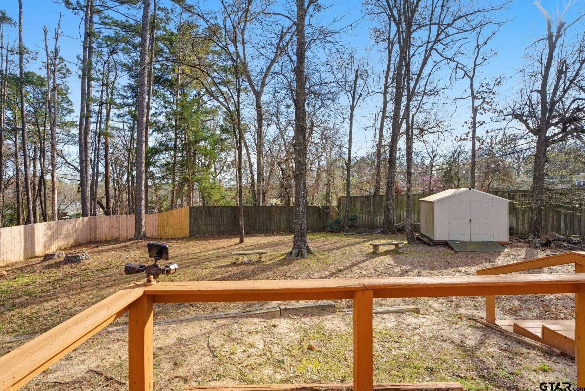 2301 McDonald Road Tyler, TX 75701 - Photo 20 of 26 a view of a backyard with large tree