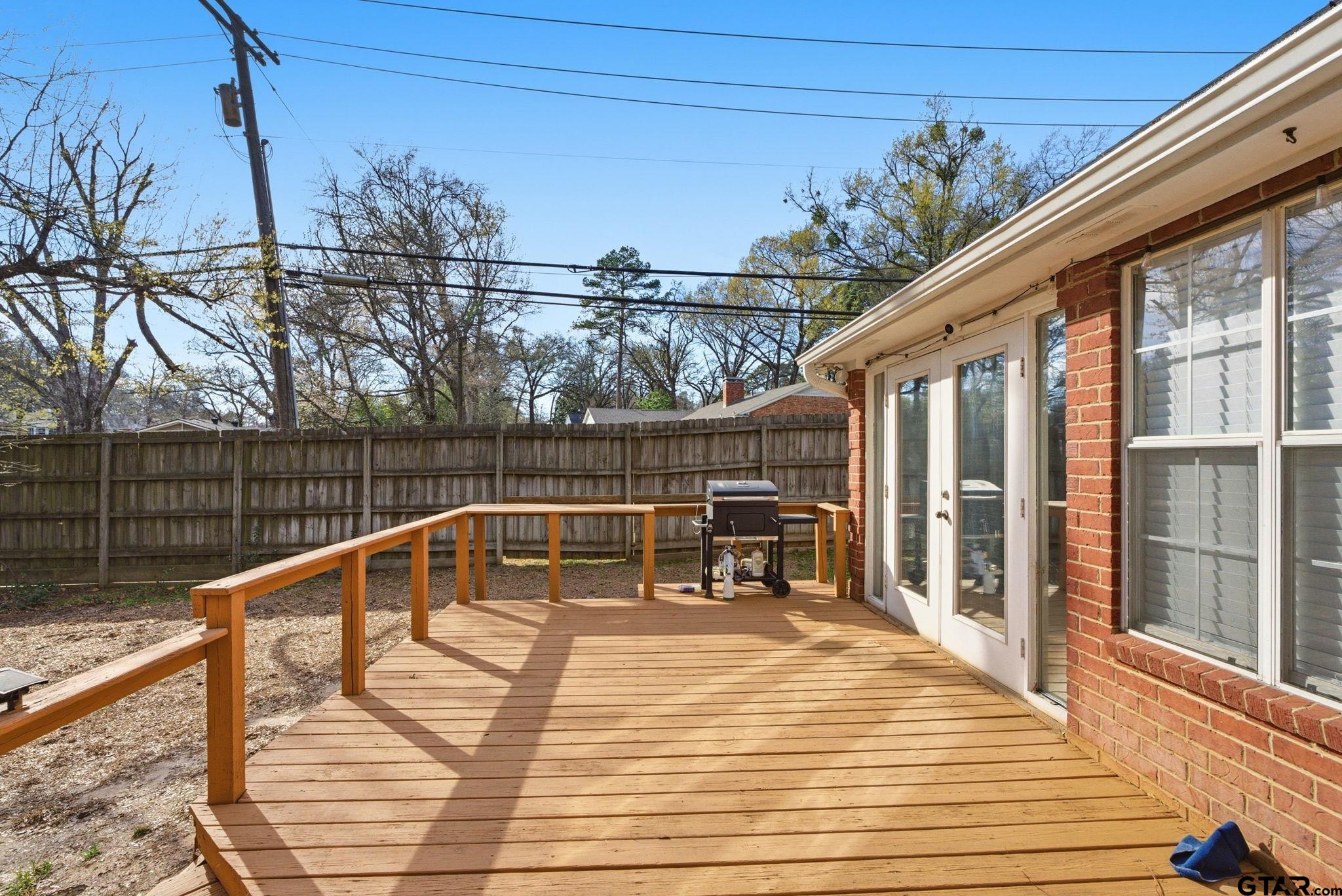 2301 McDonald Road Tyler, TX 75701 - Photo 21 of 26 a view of balcony with wooden floor and outdoor seating