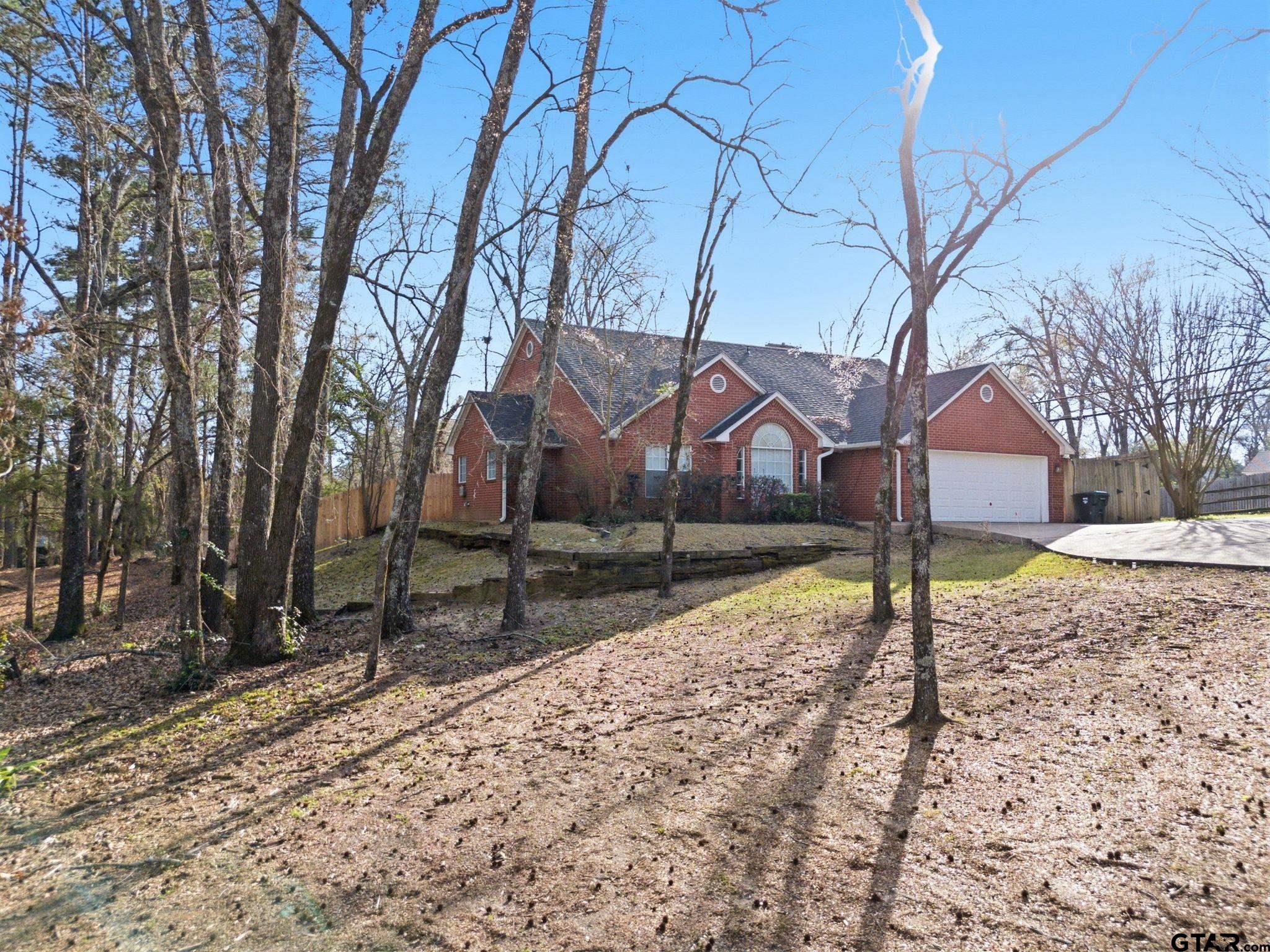 2301 McDonald Road Tyler, TX 75701 - Photo 22 of 26 a house with trees in front of it