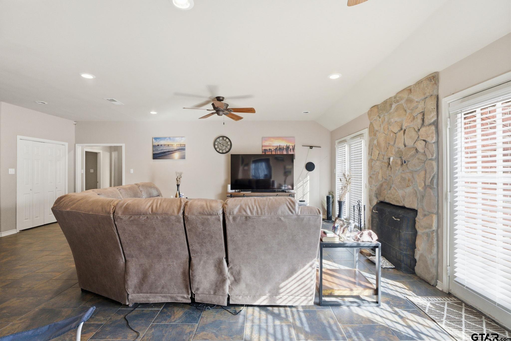 2301 McDonald Road Tyler, TX 75701 - Photo 5 of 26 a living room with furniture and a fireplace