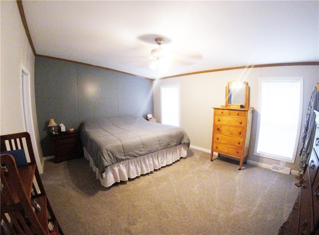 1045 Stickle Road Portersville, PA 16051 - Photo 11 of 25 The master bedroom boasts a massive walk-in closet & plenty of natural light.