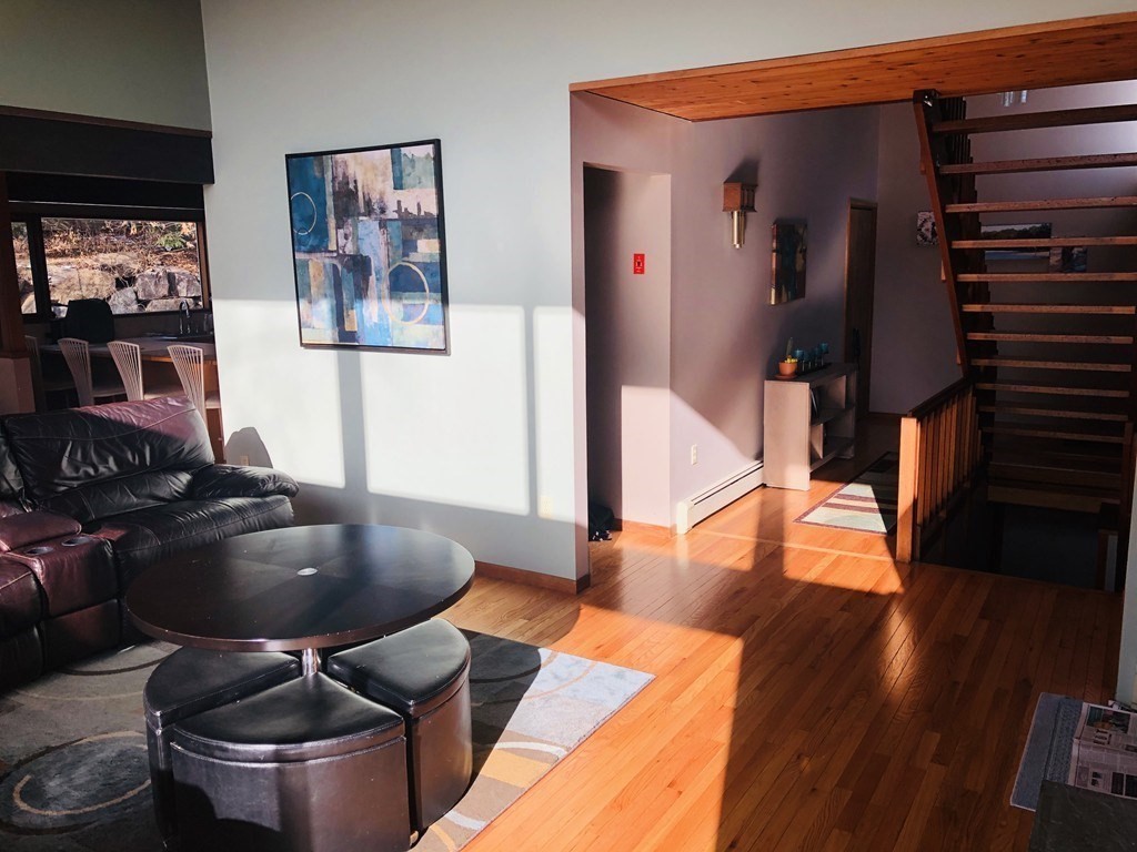 5 Clipper Way Beverly, MA 01915 - Photo 11 of 42 a room with wooden floor and furniture