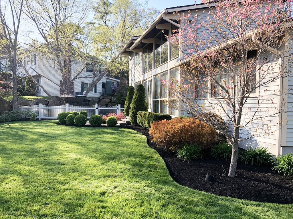 5 Clipper Way Beverly, MA 01915 - Photo 2 of 42 a front view of a house with garden