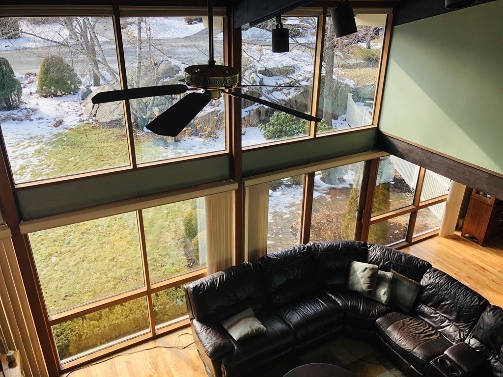 5 Clipper Way Beverly, MA 01915 - Photo 21 of 42 a living room with furniture and a floor to ceiling window