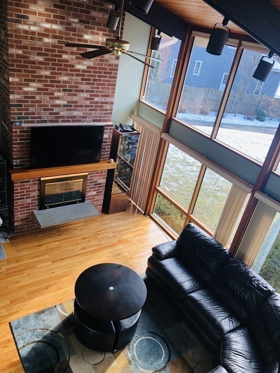 5 Clipper Way Beverly, MA 01915 - Photo 23 of 42 a room with wooden floor and furniture