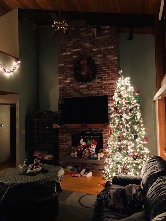 5 Clipper Way Beverly, MA 01915 - Photo 24 of 42 a living room with furniture and a fireplace